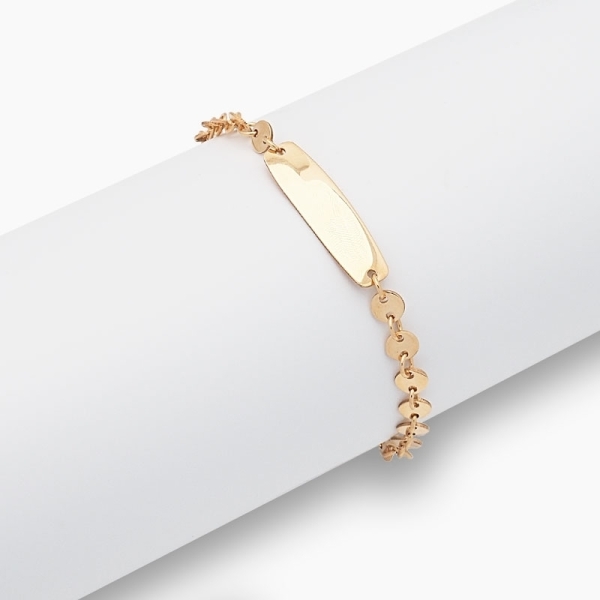 Esclava de circulitos realizada en oro amarillo de primera ley con una plaquita ideal para grabar.