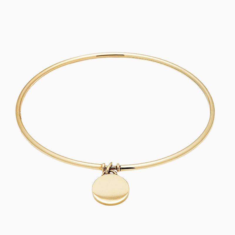 Pulsera rígida con medalla en oro amarillo