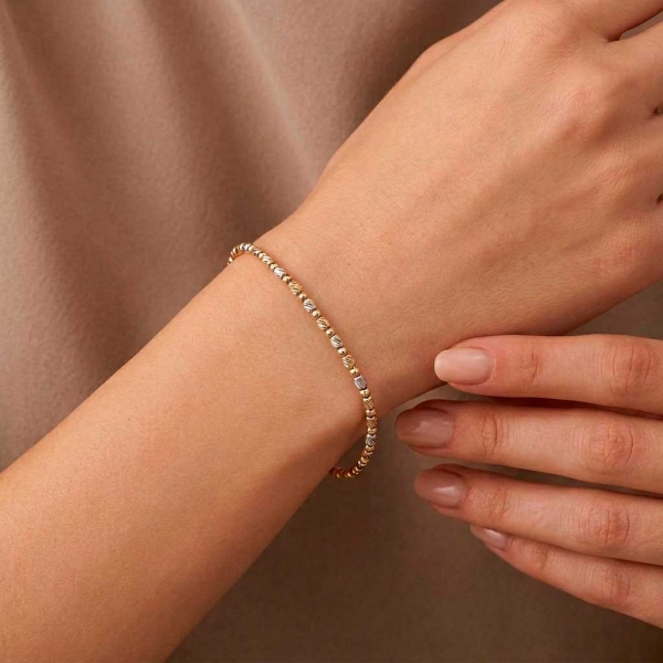 Pulsera articulada redonda en oro tricolor