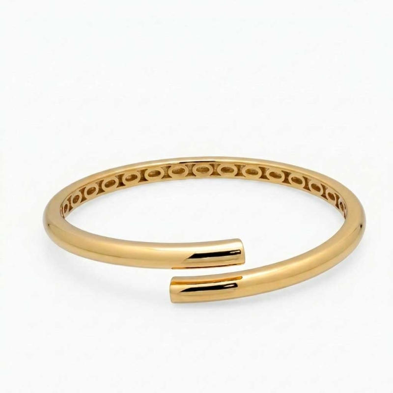 Pulsera rígida cruzada en oro amarillo