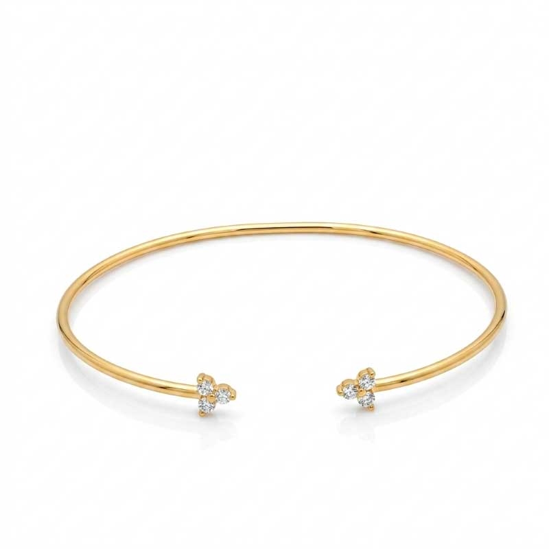 Pulsera rígida abierta en oro amarillo y circonitas