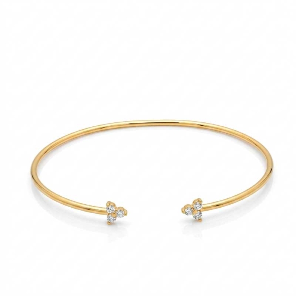 Pulsera rígida abierta en oro amarillo y circonitas