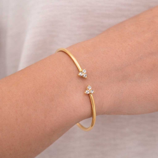 Pulsera rígida abierta en oro amarillo y circonitas